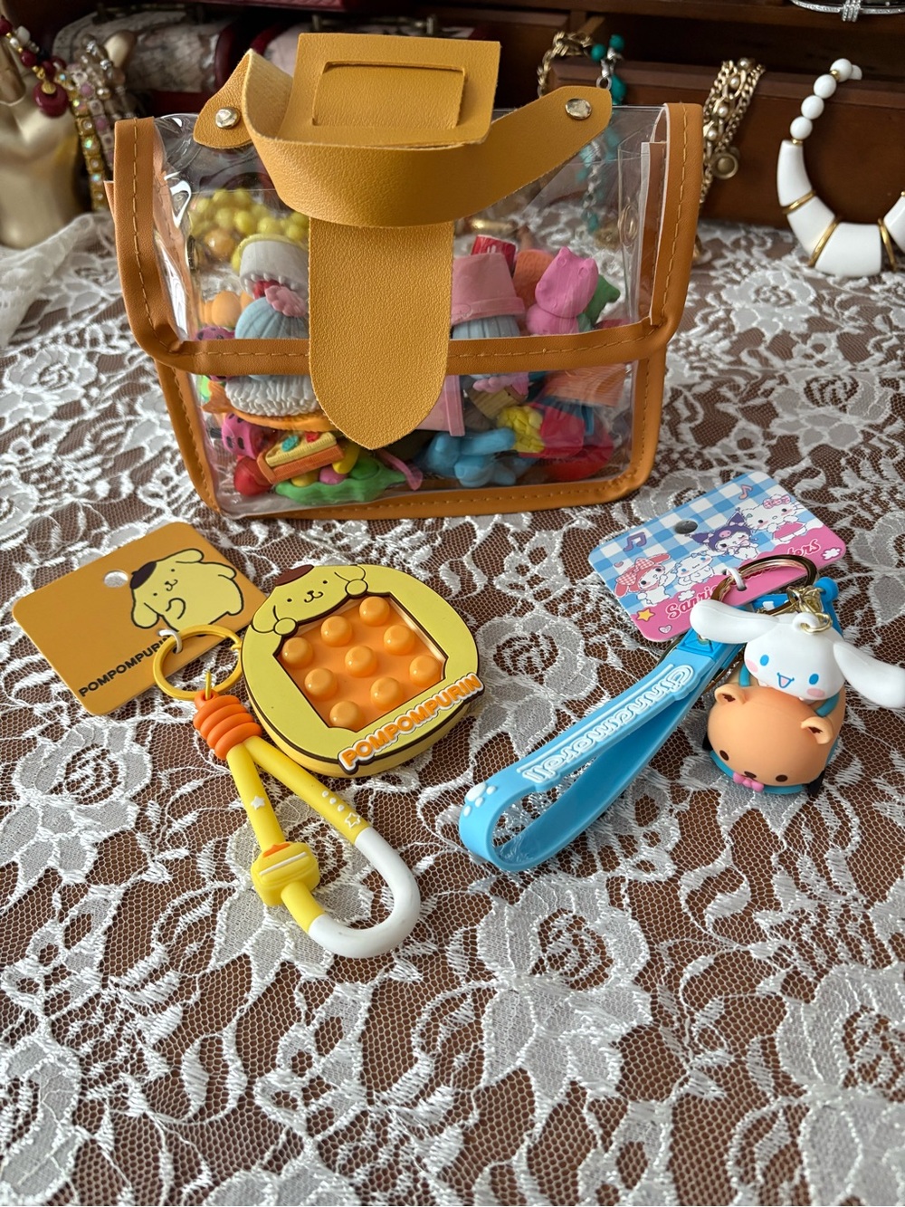 Clear Carry Bag filled with erasers and 2 keychains
